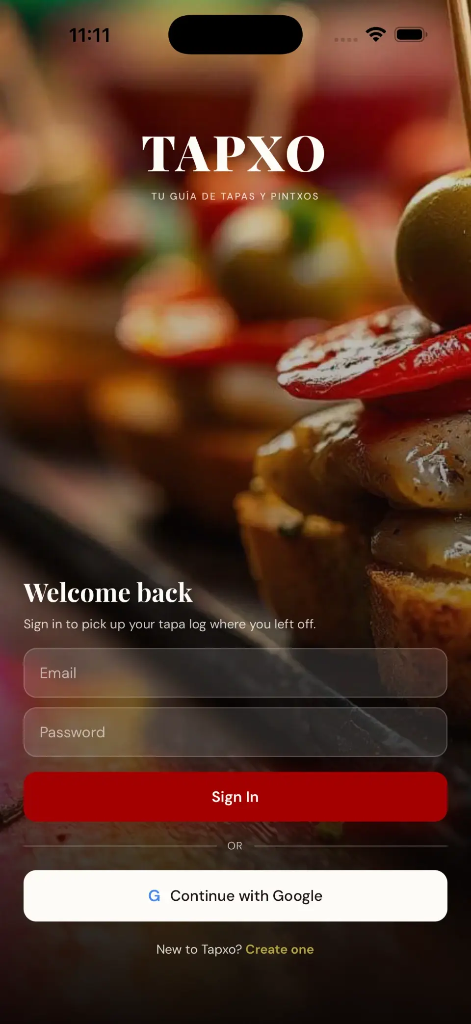 Tapxo sign-in screen over a photo of tapas and pintxos